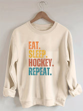 Eat Sleep Hockey Repeat Sweatshirt