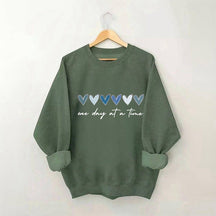 Sweat-shirt Un jour à la fois