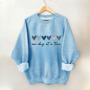 Sweat-shirt Un jour à la fois