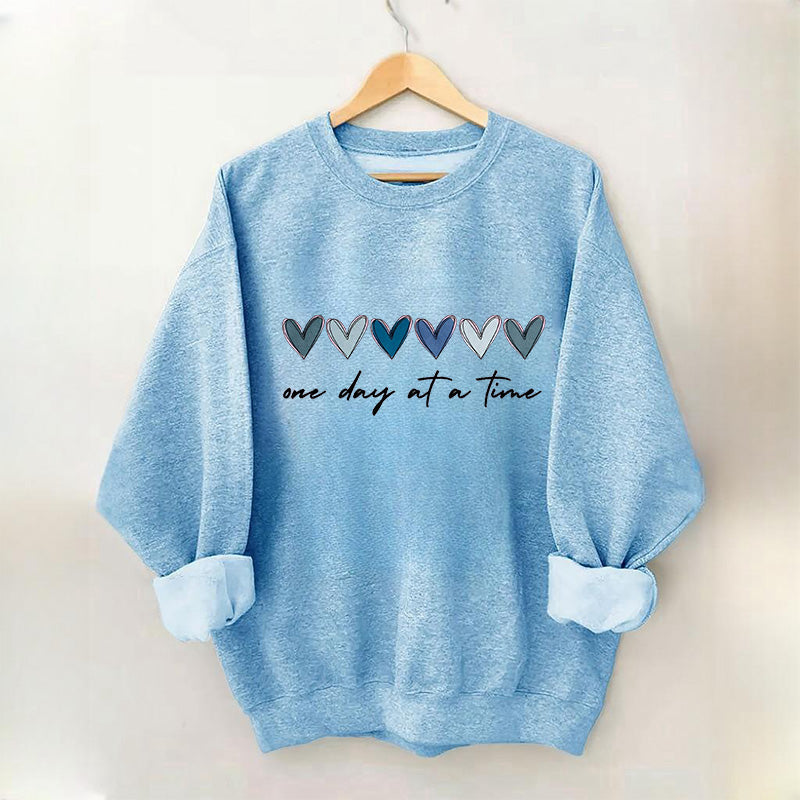 Sweat-shirt Un jour à la fois