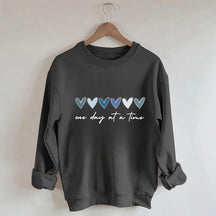 Sweat-shirt Un jour à la fois